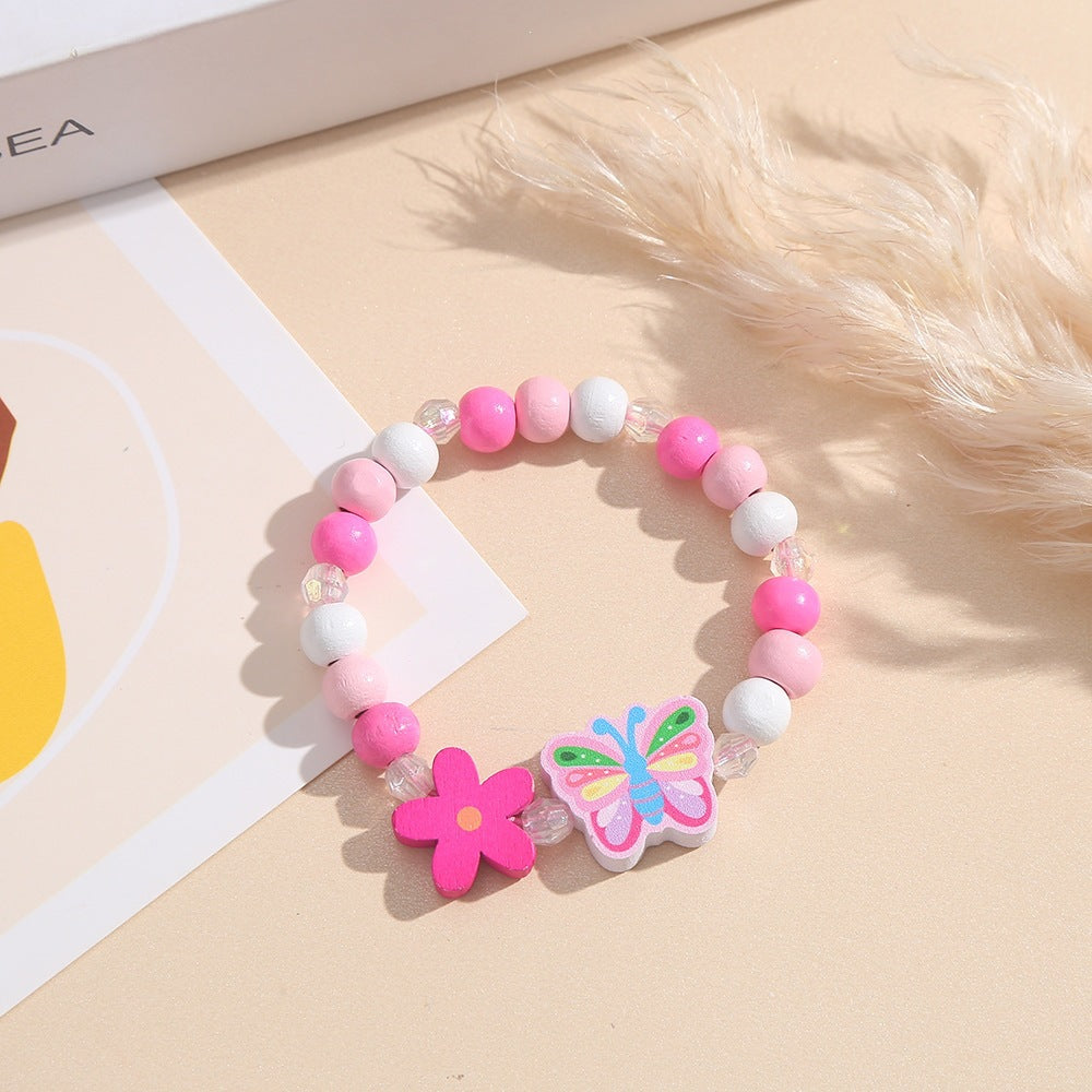 Verspieltes Armband mit Herz- und Schmetterlings-Anhängern Karnz