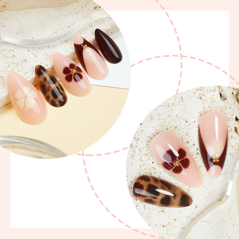 Künstlerisches Press-On-Nagelset mit floralen und tierischen Drucken Karnz