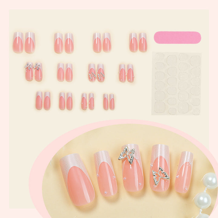 Kunstnagelset mit filigranen Designs und Schmetterlingsapplikationen Karnz