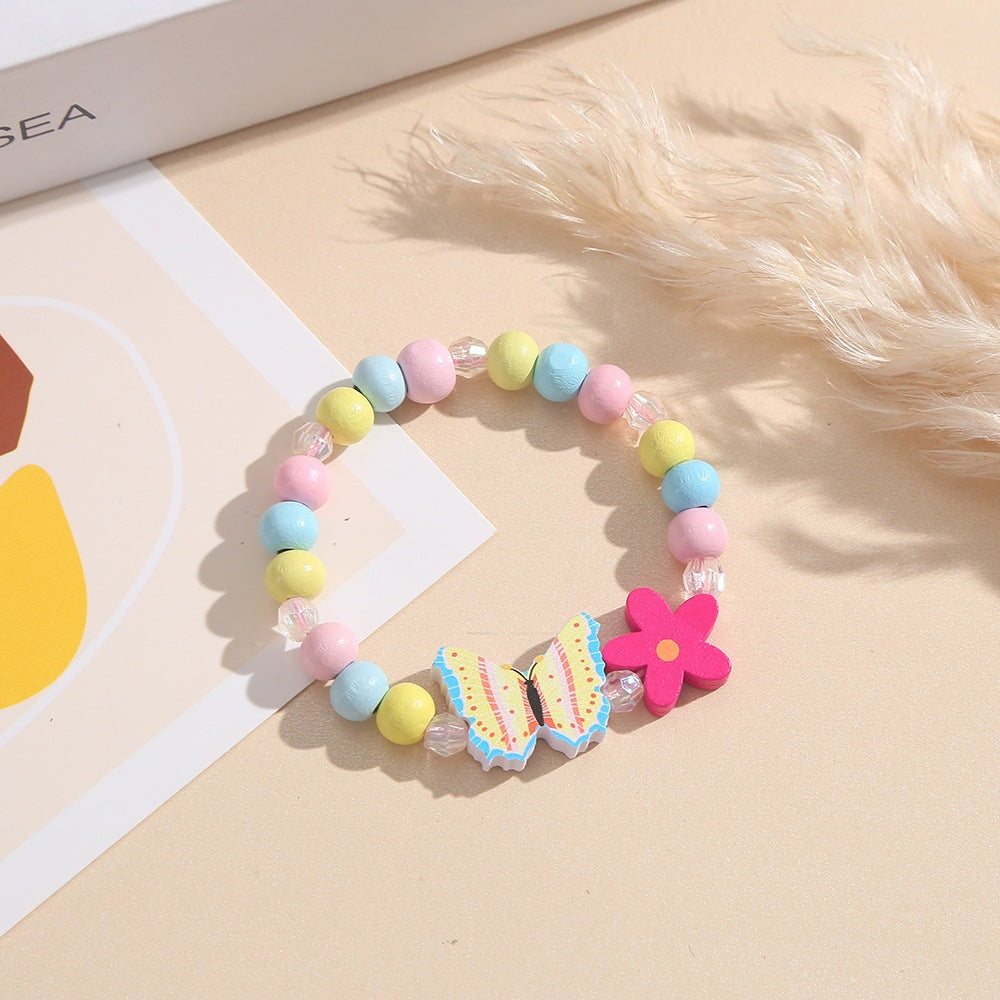 Verspieltes Armband mit Herz- und Schmetterlings-Anhängern Karnz