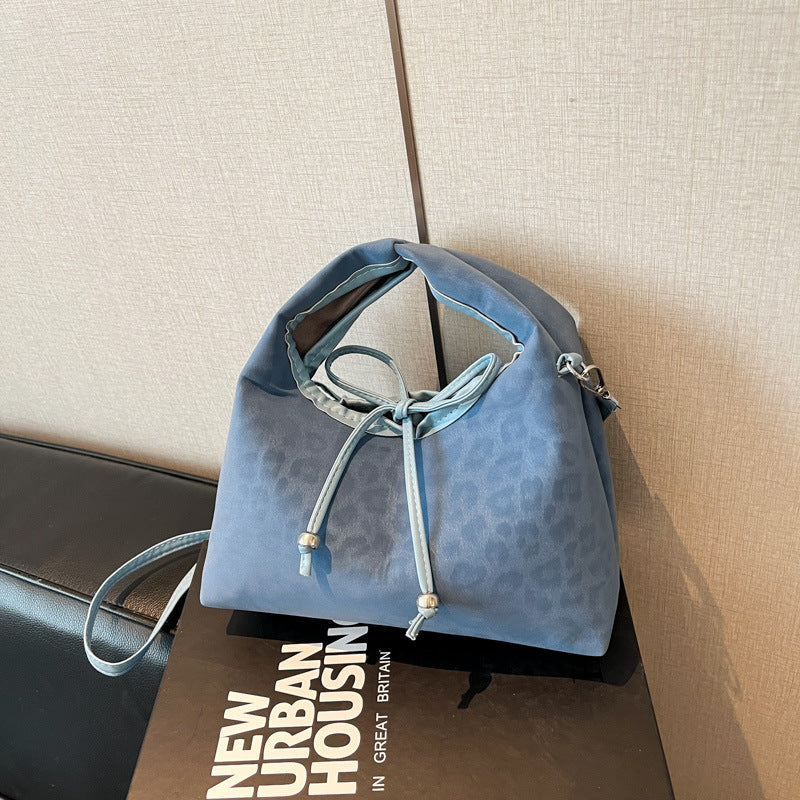 Stylische und funktionale Drawstring-Handtasche Karnz