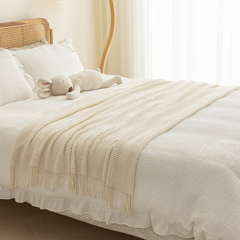 Strukturierte Strickwurfdecke