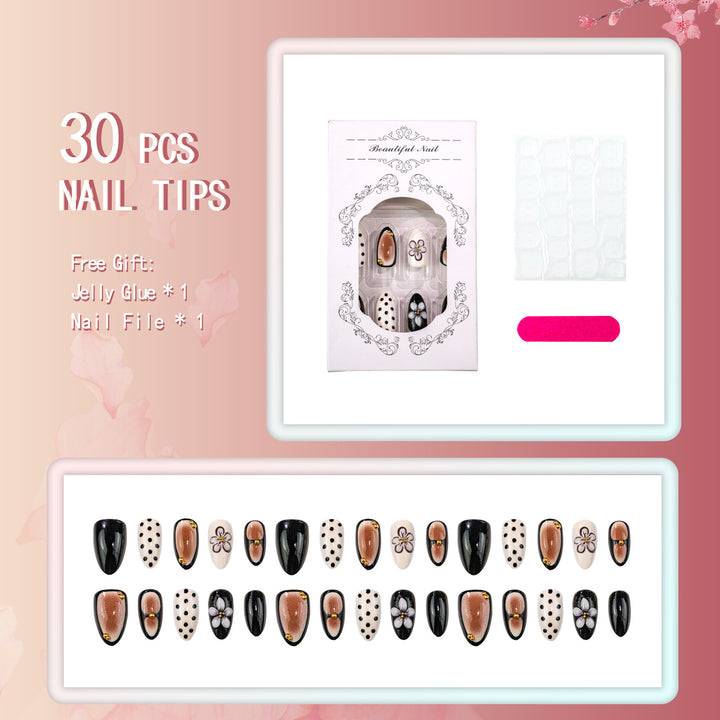 Künstlerisches Press-On-Nagelset mit floralen und gepunkteten Designs