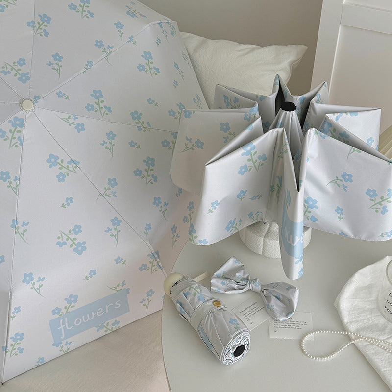 Damen Faltender Regenschirm mit stilvollem Blumendesign Karnz