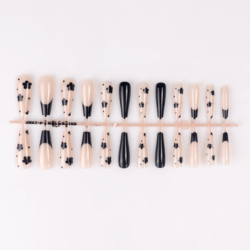 Dekorative schwarze florale Stiletto Press-On Nägel Karnz