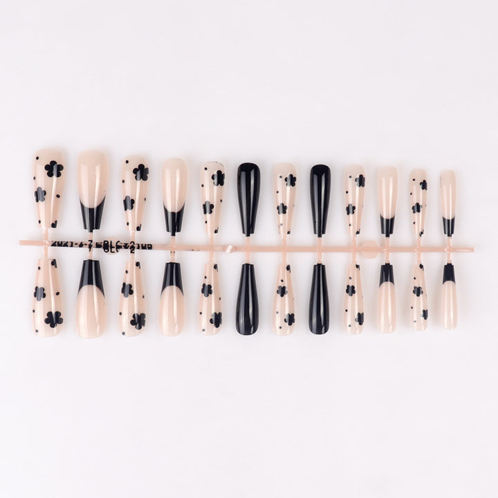 Dekorative schwarze florale Stiletto Press-On Nägel Karnz
