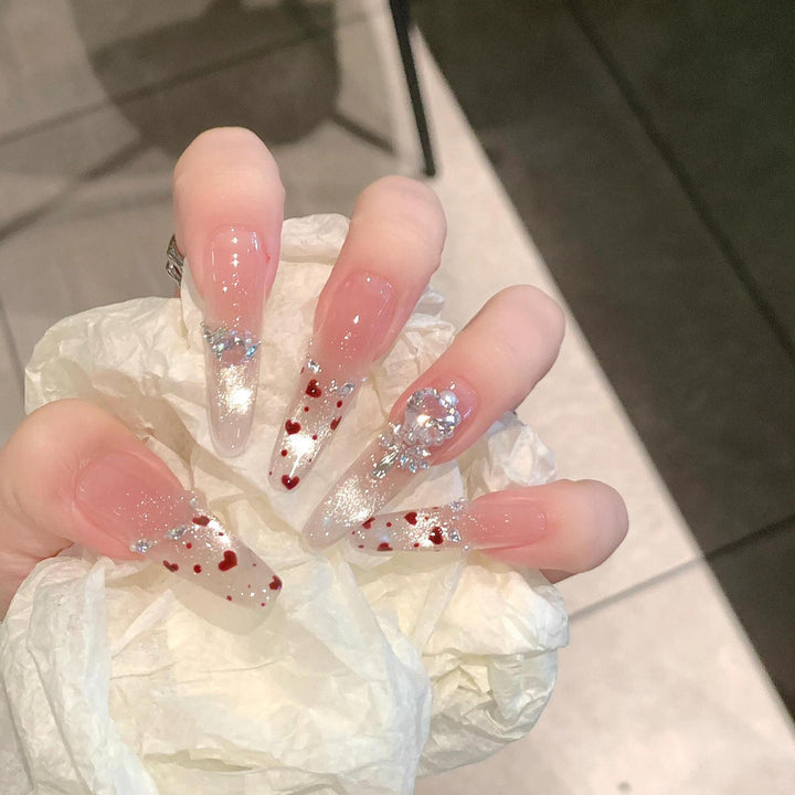 Kunstnagelset mit Funkelnden Strass- und Herzdesign Karnz