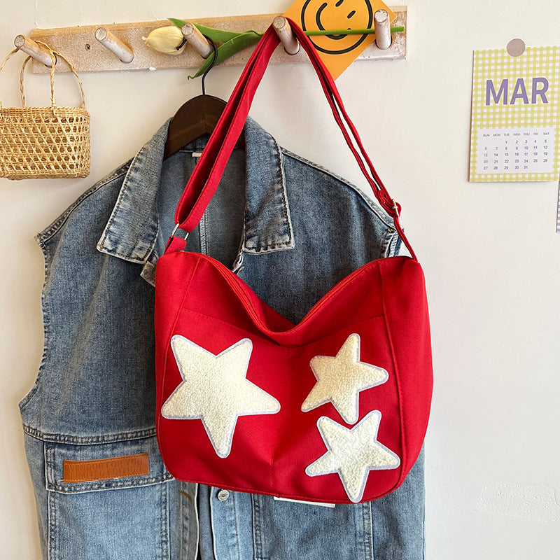 Lässige mit Sternen verzierte Schultertasche