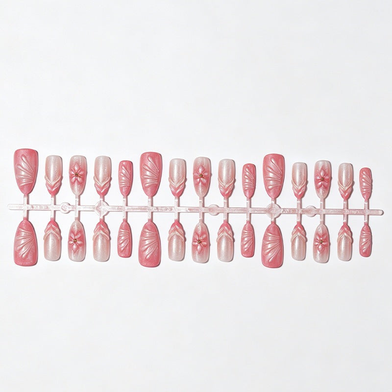 Kunstnagelset mit filigranen Blüten und Glitzerakzenten Karnz