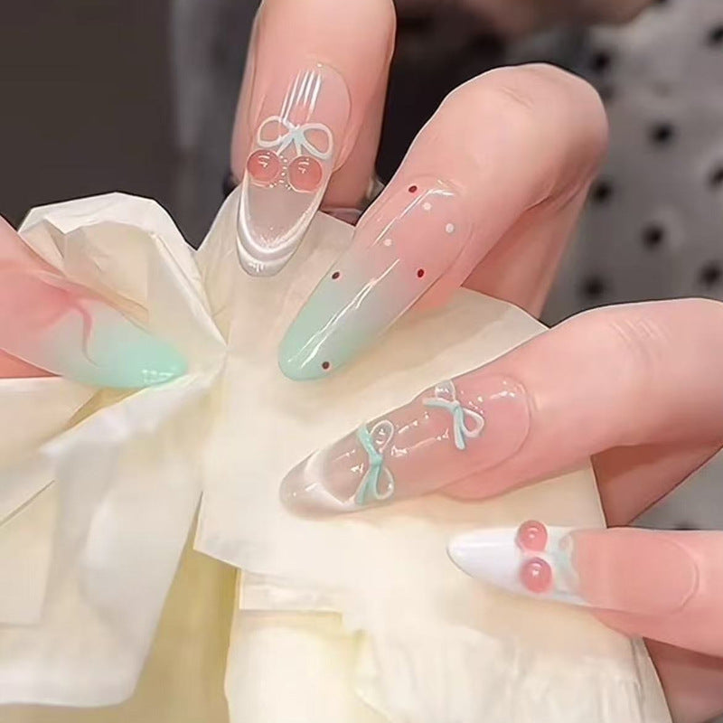 Kunstnagelset mit eleganten Schleifen- und Kirschen-Designs Karnz