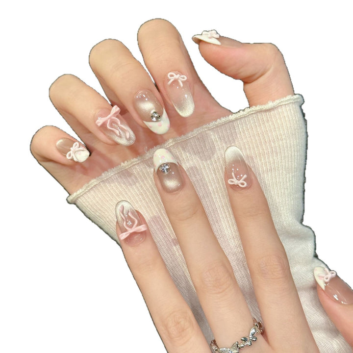 Elegantes Nagelkunst Press-On Set mit 3D Schleifenakzenten