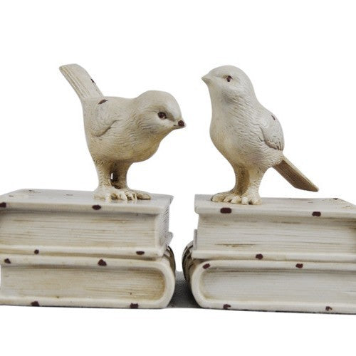 Dekorative Buchstützen mit Vogel-Figuren