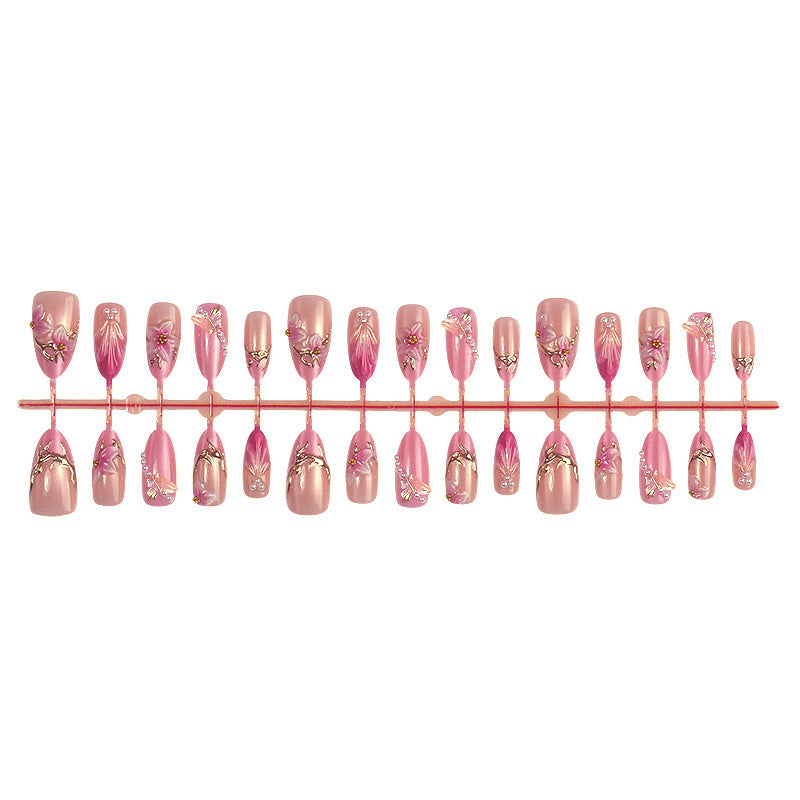 Kunstnagelset mit floralen und glitzernden Designs Karnz