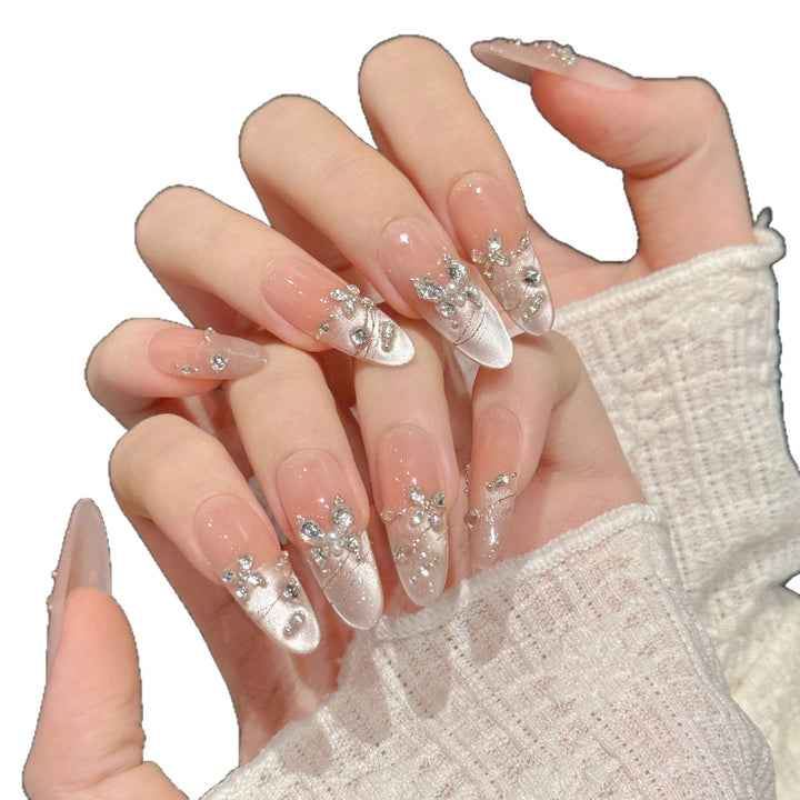 Dekorativer Press-On Nagelkunst-Set mit Strass und eleganten Details