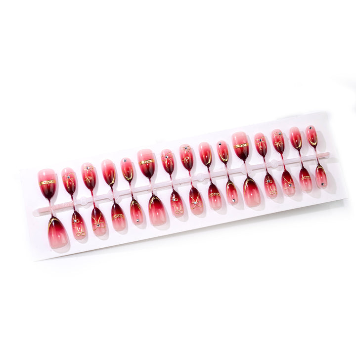 Künstlerisches Ombre Press-On Nail Art Set mit goldenen Akzenten Karnz
