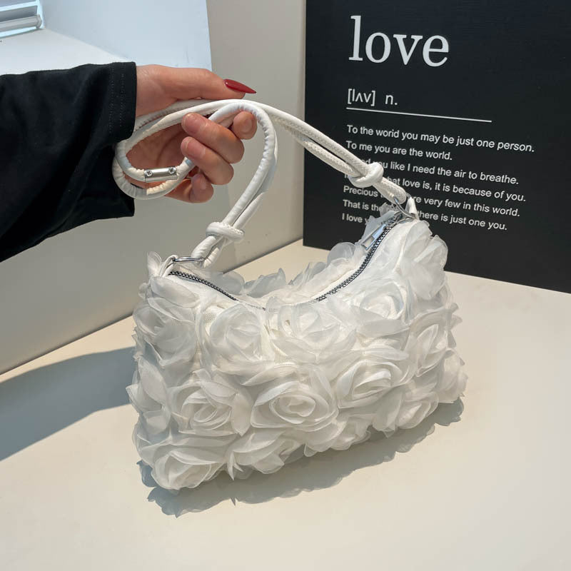 Blumenverzierte Handtasche