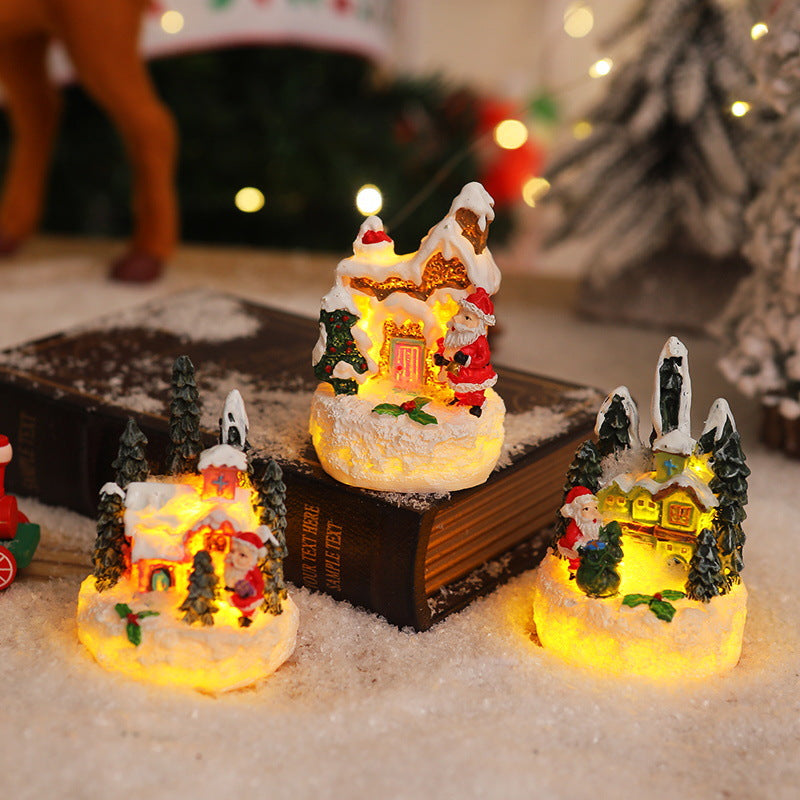 Weihnachtliche Miniaturbeleuchtung mit Schneeszenen Karnz