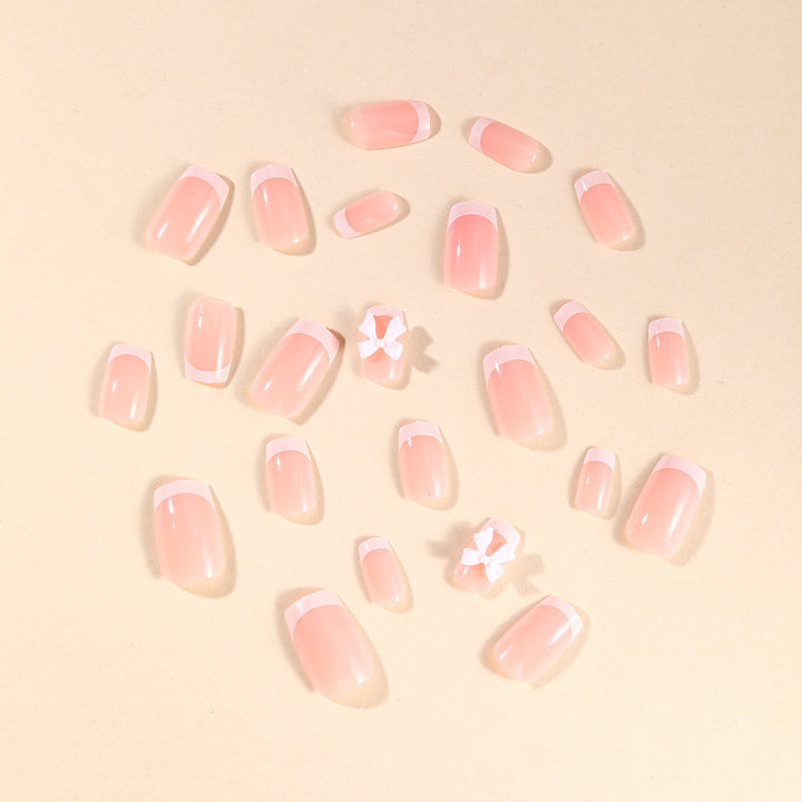 Elegante French Tip Nagelkunst mit Bow Verzierungen Karnz