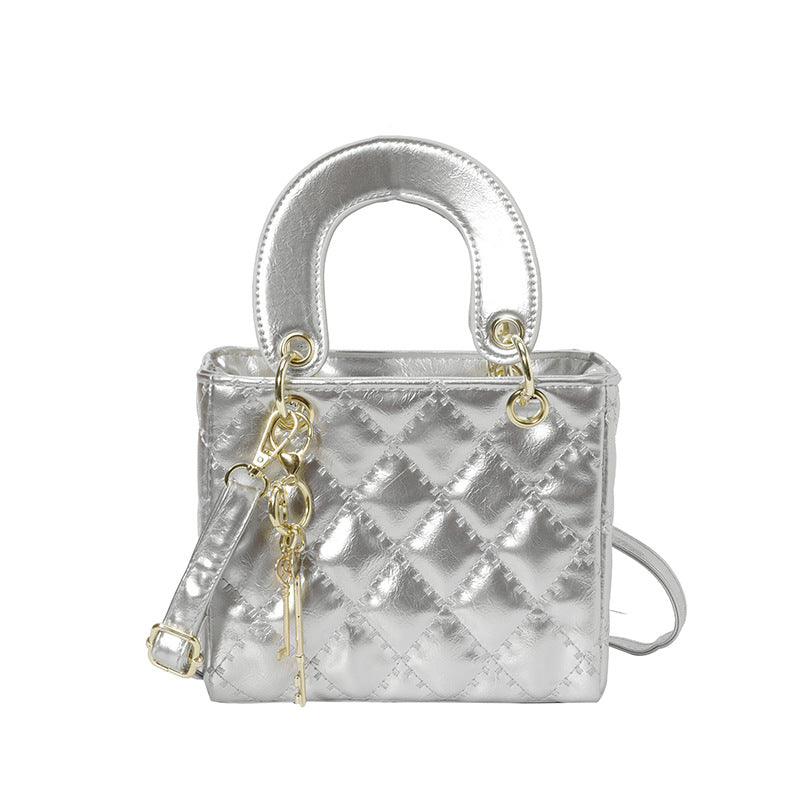 Luxuriöse Metallic Stepphandtasche