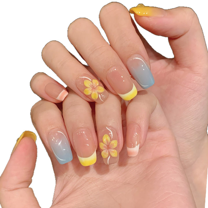 Künstlerisches Press-On-Nagelset mit floralen Designs und Ombre-Akzenten