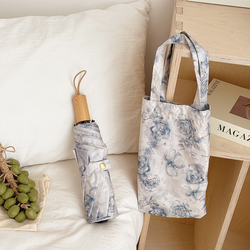 Damen Faltbarer Regenschirm mit floralen Motiven und Tragetasche Karnz