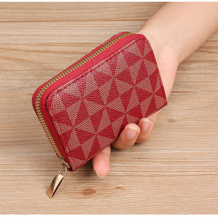 Geometrisch gemusterte Reißverschluss-Münztasche