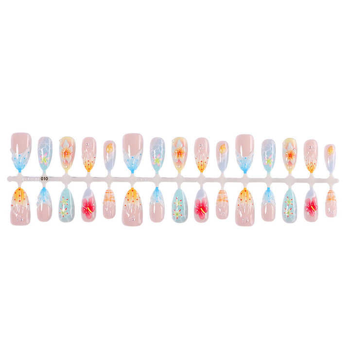 Kunstnagelset mit farbenfrohen Blumen- und maritimen Designs Karnz