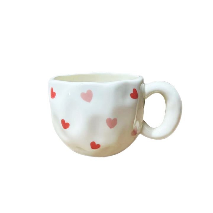 Keramik-Tasse mit handbemaltem Tulpenmuster und organischer Form