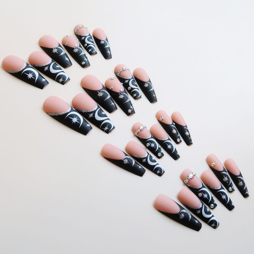 Künstlerisches langes Stiletto Press-On Nagelset mit Mond- und Sternmustern