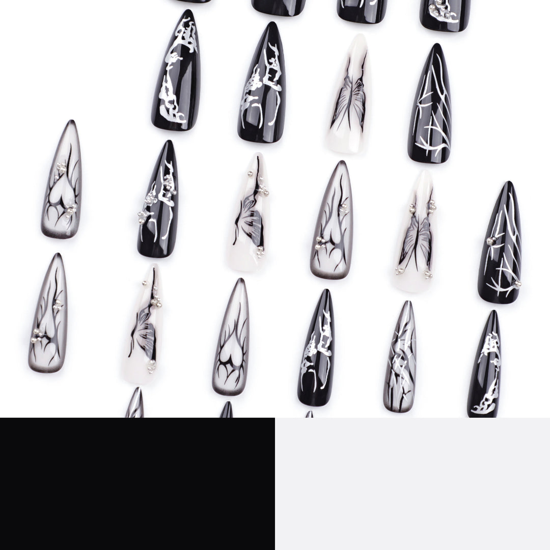 Kunstvolle Nagelkunst mit elegantem Schwarz-Weiß-Design Karnz