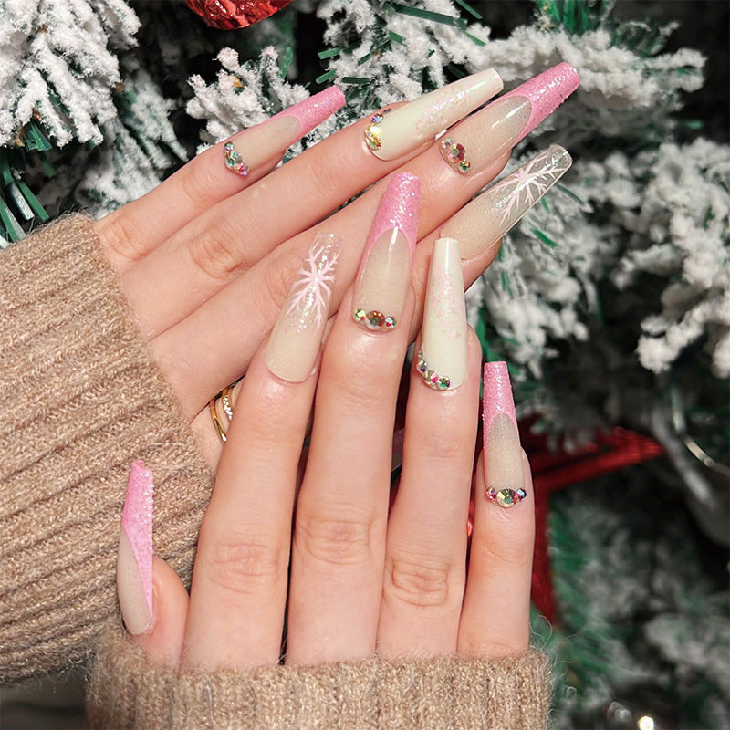 Kunstvolle Stiletto-Nägel mit Glitzer- und Schneeflockendesign Karnz