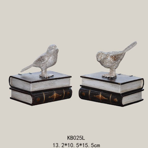 Dekorative Buchstützen mit Vogel-Figuren
