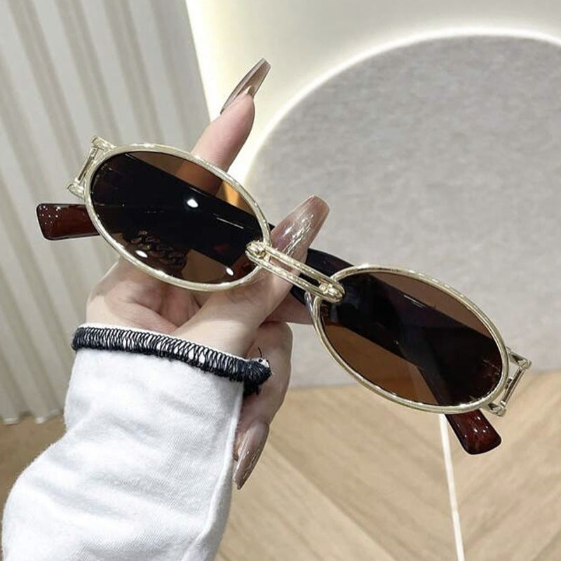 Damen ovalförmige Sonnenbrille mit goldenen Akzenten und stylischem Rahmen Karnz