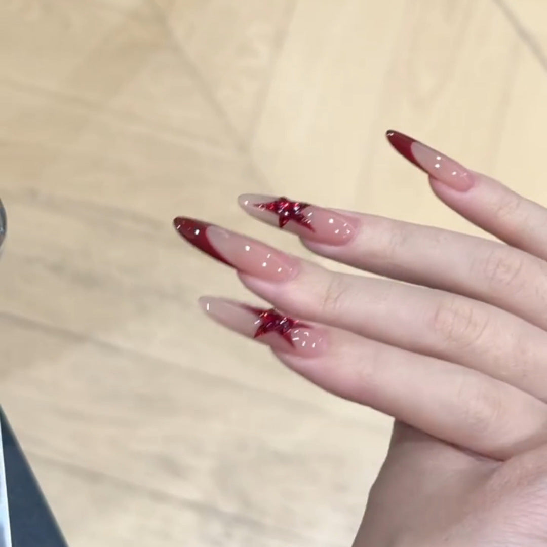 Kunstnägel mit Glitzerstern-Design Karnz