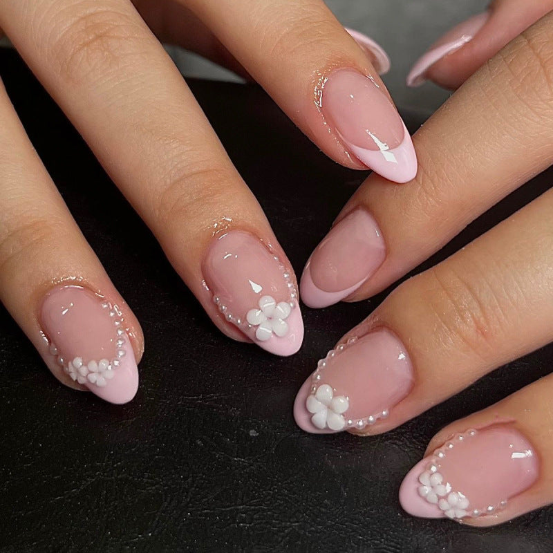 Künstliche Nagelkunst mit verspielten Punkten und Schleifen Karnz
