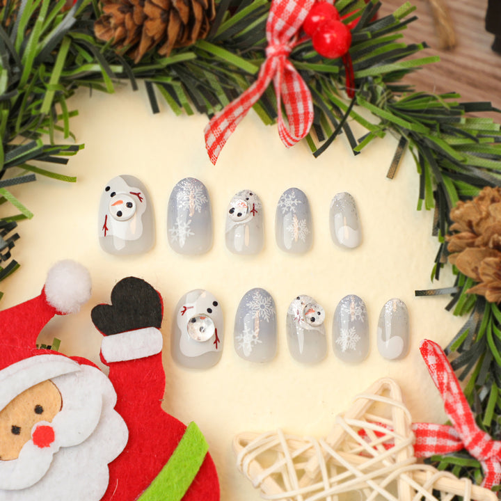 Kunstvolle Winter-Nagelverlängerungen mit Schneemann-Design Karnz