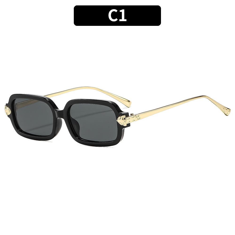 Hochwertige winkelige Sonnenbrille mit goldenen Akzenten