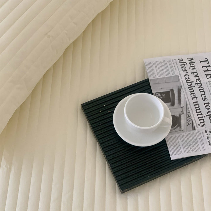 Gepolsterte rutschfeste Matratzenauflage mit elastischem Spannbezug
