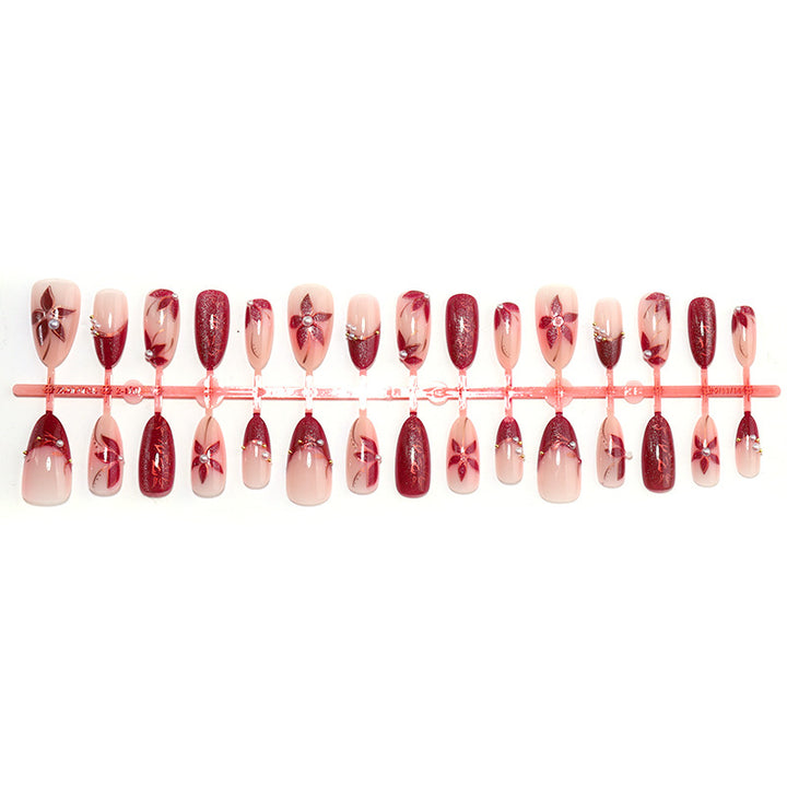 Elegantes Druck-On-Nagelset mit floralem und gem-ähnlichem Akzent Karnz