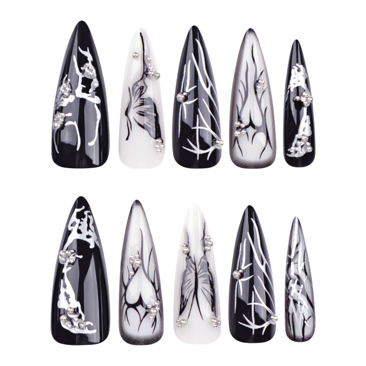 Kunstvolle Nagelkunst mit elegantem Schwarz-Weiß-Design Karnz