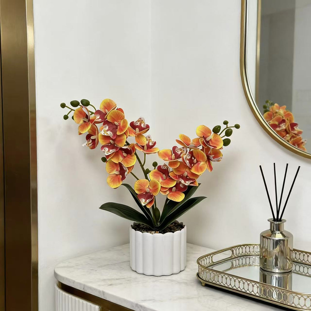 Elegante künstliche Orchideenpflanzenanordnung für die Innendekoration
