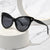 Damen modische Cat-Eye Sonnenbrille mit transparentem Rahmen und blauen Gläsern Karnz