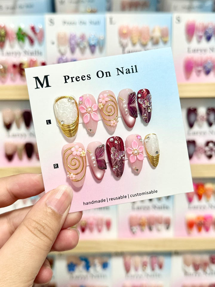 Künstlerisches Press-On-Nagel-Set mit floralen und grünen Akzenten