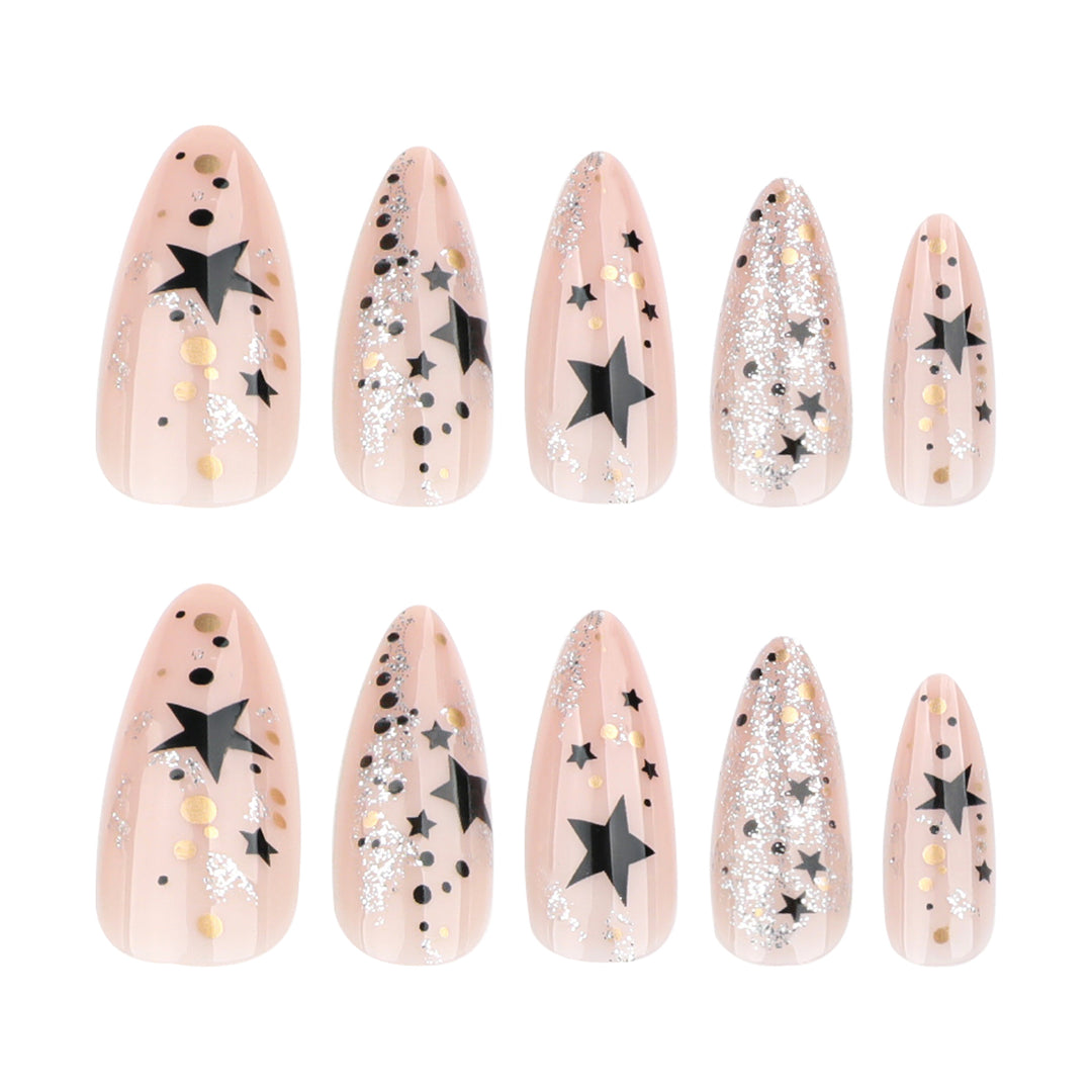 Kunstvolle Stiletto-Nägel mit Glitzer- und Sternenmotiv Karnz