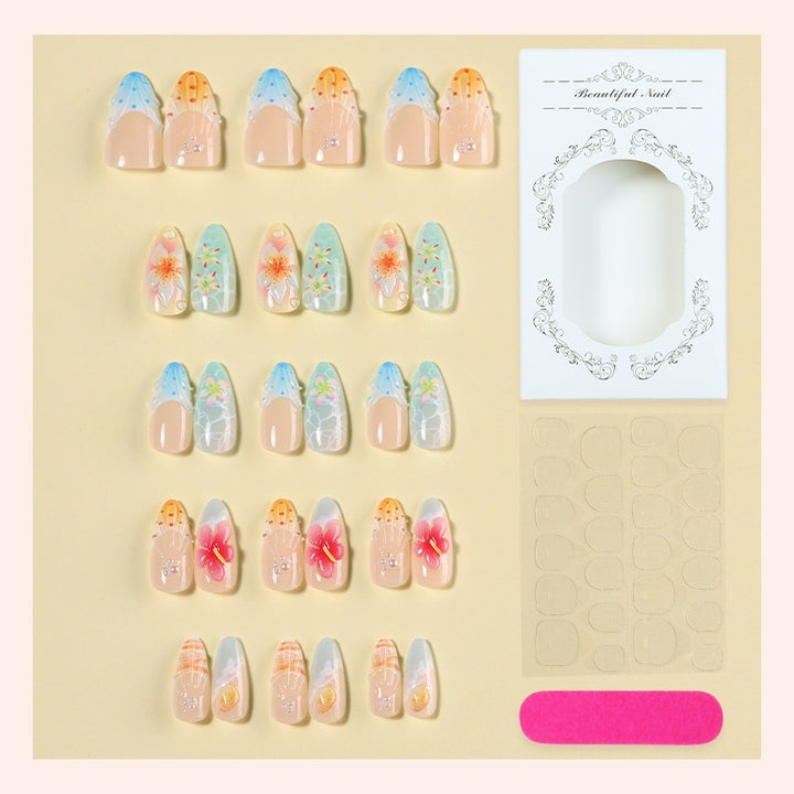Kreatives Kunstnagelset mit floralen und bunten Designs Karnz