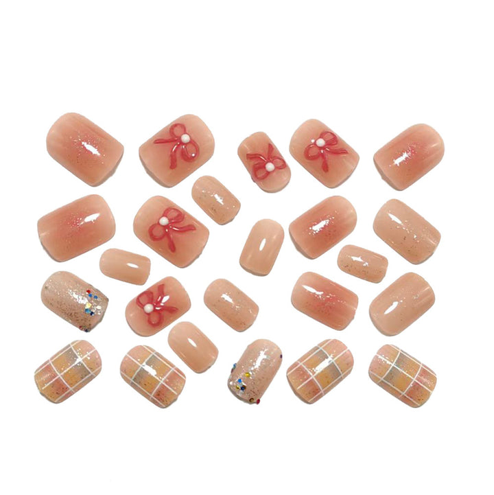 Kreatives Kunstnagelset mit Glitzer und Blumenapplikationen Karnz