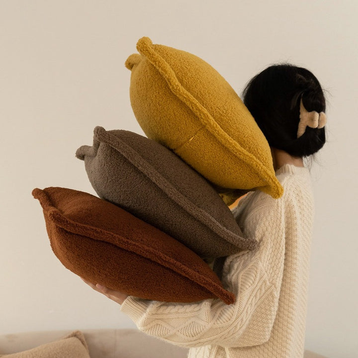 Dekoratives Teddy‑Fleece‑Kissen mit wattierter Füllung und Kedernaht