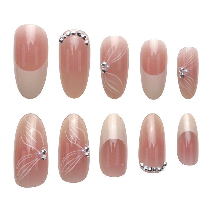 Elegante lange Stiletto-Presse-Nägel mit floralem und Schmuckakzenten Karnz