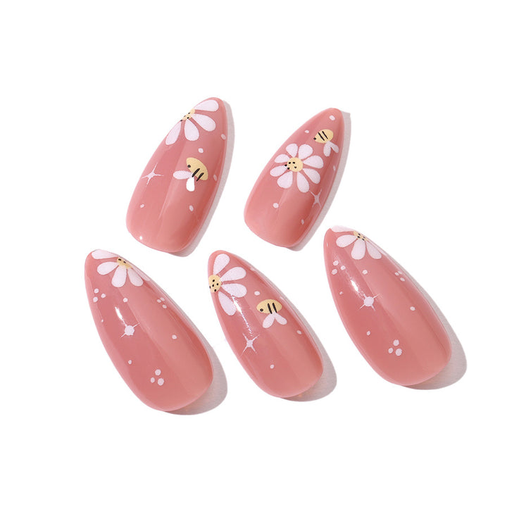 Kunstnägel Set mit eleganten Blüten und Glitzerakzenten Karnz
