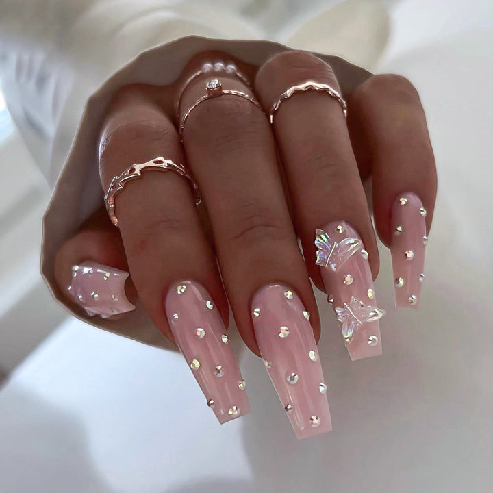 Künstliche Nagelspitzen mit glamourösen Strass- und Schmetterlingsmotiven Karnz